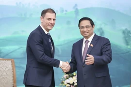 Thủ tướng Phạm Minh Chính tiếp Bộ trưởng Bộ Tư pháp Hungary Tuzson Bence. (Ảnh: Dương Giang/TTXVN)