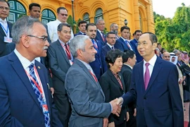 Chủ tịch nước Trần Đại Quang với các đại biểu. (Ảnh: Nhan Sáng/TTXVN)