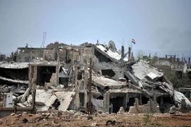 Cảnh đổ nát do xung đột giữa quân Chính phủ Syria và phiến quân tại al-Qadam, phía nam Damascus ngày 29/4. (Nguồn: THX/TTXVN)