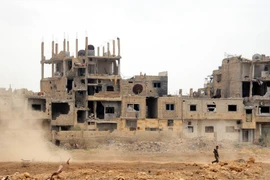 Cảnh đổ nát sau các cuộc xung đột ở Damascus, Syria ngày 22/5. (Nguồn: THX/TTXVN)