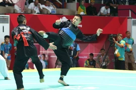 Võ sỹ Nguyễn Ngọc Toản (đai đỏ) thi đấu trận chung kết dưới 65kg ở ASIAD 2018. (Ảnh: Trọng Tuệ/TTXVN)