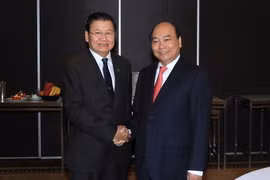 Sáng 17/3/2018, tại Thành phố Sydney, Thủ tướng Nguyễn Xuân Phúc gặp Thủ tướng Lào Thongloun Sisoulith. (Ảnh: Thống Nhất/TTXVN)
