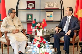 Chủ tịch nước Trần Đại Quang tiếp Chủ tịch đảng Công nhân Bangladesh Rashed Khan Menon. (Ảnh: Nhan Sáng/TTXVN)