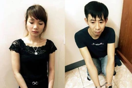 Hai đối tượng Đặng Thị Phương và Nguyễn Văn Hiên. (Ảnh: Nguyễn Hoàng/TTXVN)