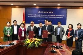 Lễ chuyển giao quyền đại diện vốn nhà nước tại Vinatex từ Bộ Công Thương về SCIC. (Ảnh: Đức Duy/Vietnam+)