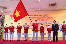 Lễ xuất quân Đoàn Thể thao Việt Nam tham dự Thế vận hội Olympic Tokyo tại Hà Nội diễn ra vào tối 13/7. (Ảnh: PV/Vietnam+) 