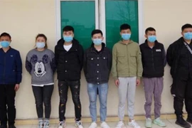 Các đối tượng nhập cảnh trái phép bị bắt giữ. (Ảnh: TTXVN phát)