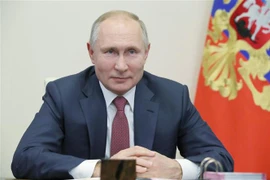 Tổng thống Nga Vladimir Putin trong một cuộc họp trực tuyến tại Novo-Ogaryovo, ngoại ô Moskva. (Ảnh: AFP/TTXVN)