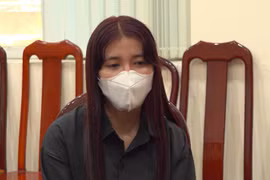 Phan Thị Kim Huệ tại cơ quan Công an. (Nguồn: cand.com.vn)