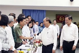 Chủ tịch nước Nguyễn Xuân Phúc với các đại biểu dự buổi làm việc. (Ảnh: Thống Nhất/TTXVN)