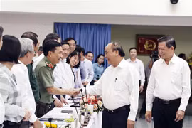 Chủ tịch nước Nguyễn Xuân Phúc với các đại biểu dự buổi làm việc. (Ảnh: Thống Nhất/TTXVN)