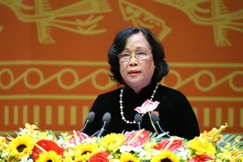 Đồng chí Phạm Thị Hải Chuyền, Ủy viên Trung ương Đảng, Bộ trưởng Bộ Lao động-Thương binh và Xã hội trình bày tham luận. (Ảnh: TTXVN)