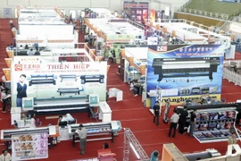 Các loại máy móc thiết bị in ấn tại một triển lãm. (Ảnh: Thế Anh-TTXVN)