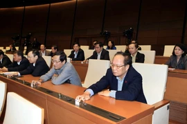 Các đại biểu Quốc hội bấm nút biểu quyết thông qua Nghị quyết miễn nhiệm Phó Chủ tịch Quốc hội, một số thành viên Ủy ban Thường vụ Quốc hội, Chủ tịch Hội đồng Dân tộc, Chủ nhiệm một số Ủy ban của Quốc hội. (Ảnh: Phạm Kiên/ TTXVN)