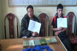 Các đối tượng bị bắt tại cơ công an. (Ảnh: Lê Hữu Quyết/TTXVN)