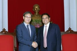 Trưởng Ban Tổ chức Trung ương Đảng Phạm Minh Chính tiếp Đại sứ Lào. (Ảnh: Nguyễn Dân/TTXVN)