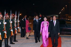 Quang cảnh lễ tiễn tại sân bay quốc tế Wattay, thủ đô Vientiane. (Ảnh: Thống Nhất/TTXVN)