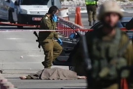 Hiện trường vụ tấn công giữa người Palestine và Israel tại Bờ Tây. (Nguồn: AFP/TTXVN)