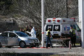 Hiện trường vụ tấn công giữa người Palestine và Israel tại Bờ Tây. (Nguồn: AFP/TTXVN)