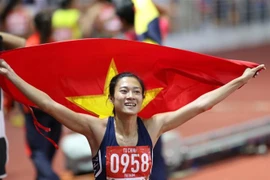 Niềm vui của Tú Chinh khi về đích. (Ảnh: Hoàng Linh/TTXVN)