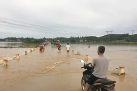 Nước lũ dâng cao tại huyện miền núi Thạch Thành (tỉnh Thanh Hóa). (Ảnh: Nguyễn Nam/TTXVN)