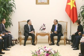 Ông Trương Hòa Bình, Ủy viên Bộ Chính trị, Phó Thủ tướng Thường trực Chính phủ tiếp ông Phó Chính Hoa, Ủy viên Trung ương Đảng, Thứ trưởng Thường trực Bộ Công an Trung Quốc. (Ảnh: Doãn Tấn/TTXVN)