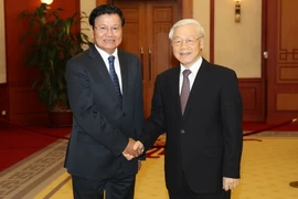 Tổng Bí thư Nguyễn Phú Trọng tiếp Thủ tướng nước Cộng hòa Dân chủ Nhân dân Lào Thongloun Sisoulith thăm Việt Nam. (Ảnh: Trí Dũng/TTXVN)