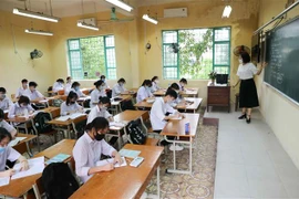 Học sinh trong lớp không bắt buộc đeo khẩu trang nhưng phải đeo trong giờ ra chơi. (Ảnh: Thanh Tùng/TTXVN)