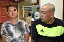 Đối tượng Nguyễn Quốc Hùng (trái) và Nghiêm Công Dũng, hai trong sáu đối tượng thuộc đường dây buôn bán 490 bánh heroin. (Nguồn: TTXVN)