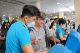 Vietnam Airlines Group đã phối hợp với các sân bay trên toàn quốc tăng cường quầy thủ tục, nhân sự mặt đất phục vụ hành khách. (Ảnh: CTV/Vietnam+)