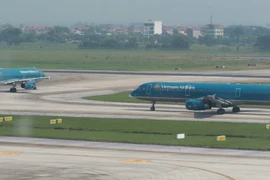 Máy bay của Hãng hàng không Vietnam Airlines tại Sân bay Quốc tế Nội Bài. (Ảnh: Việt Hùng/Vietnam+)