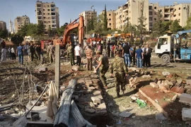 Lực lượng an ninh Syria làm việc sau một vụ ném bom. (Ảnh: AFP/TTXVN)
