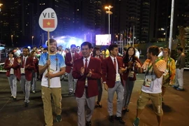 Đoàn Thể thao Việt Nam tham dự Olympic 2016 được chào đón trước Lễ thượng cờ tại Làng Olympic ở Rio de Janeiro, Brazil ngày 1/8. (Ảnh: AFP/TTXVN)