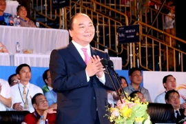 Thủ tướng Nguyễn Xuân Phúc phát biểu, tuyên bố khai mạc Đại hội. (Ảnh: Thống Nhất/TTXVN)