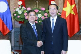 Chủ tịch nước Trần Đại Quang tiếp Phó Chủ tịch Quốc hội Lào Somphanh Phengkhammy đang thăm chính thức Việt Nam. (Ảnh: Nhan Sáng/TTXVN)