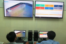 Phòng điều hành Trung tâm quan trắc tự động giám sát việc xả thải của Công ty TNHH gang thép Hưng Nghiệp Formosa Hà Tĩnh tại Khu kinh tế Vũng Áng. (Ảnh: Phan Quân/TTXVN)