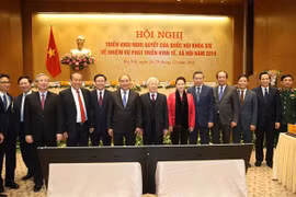Tổng Bí thư, Chủ tịch nước Nguyễn Phú Trọng, Thủ tướng Chính phủ Nguyễn Xuân Phúc, Chủ tịch Quốc hội Nguyễn Thị Kim Ngân và các đại biểu dự Hội nghị. (Ảnh: Trí Dũng/TTXVN)
