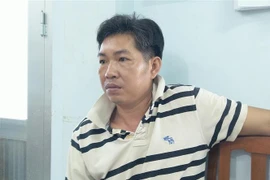 Đối tượng Huỳnh Thanh Nhàn tại cơ quan Công an. (Ảnh: TTXVN phát)