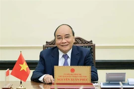 Chủ tịch nước Nguyễn Xuân Phúc điện đàm với Tổng thống Indonesia Joko Widodo. (Ảnh: Thống Nhất/TTXVN)