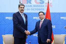 Thủ tướng Phạm Minh Chính gặp Tổng thống Venezuela Nicolas Maduro. (Ảnh: Dương Giang/TTXVN)