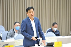 Thứ trưởng Bộ Giao thông vận tải Nguyễn Ngọc Đông tại Phiên họp báo Chính phủ tối 28/1. (Ảnh: Minh Đức/TTXVN)