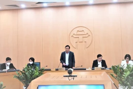Phó Bí thư Thành ủy Hà Nội Nguyễn Văn Phong phát biểu tại cuộc họp của Ban Chỉ đạo phòng, chống dịch COVID-19 thành phố với các quận, huyện. (Ảnh: PV/Vietnam+)
