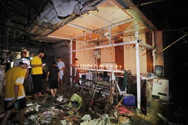 Các cửa hàng bị phá huỷ sau vụ đánh bom tại khu chợ đông đúc ở Sadr, ngoại ô Baghdad (Iraq), ngày 19/7/2021. (Ảnh: AFP/TTXVN)