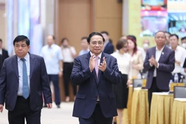 Thủ tướng Phạm Minh Chính đến dự Hội nghị công bố và triển khai Quy hoạch tổng thể quốc gia thời kỳ 2021-2030. (Ảnh: Dương Giang/TTXVN)
