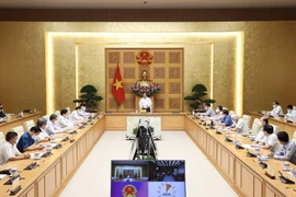 Thủ tướng Phạm Minh Chính gặp gỡ bác sỹ, nhà khoa học, nhà giáo trong lĩnh vực y tế (Ảnh: Dương Giang/TTXVN)