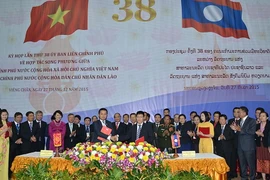 Lễ ký ​hợp đồng tín dụng cho Dự án Thủy điện Nặm-mô 2 giữa Ngân hàng BIDV và Công ty TNHH Thủy điện Nặm-mô Việt Nam. (Ảnh: Phạm Kiên-Nguyễn Chiến/Vietnam+)