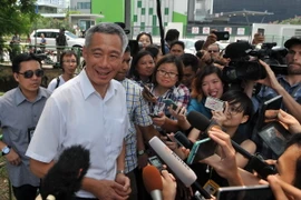 Theo kết quả kiểm phiếu mẫu, đảng PAP của Thủ tướng Lý Hiển Long đủ điều kiện thành lập chính phủ mới. (Ảnh: AFP/TTXVN)
