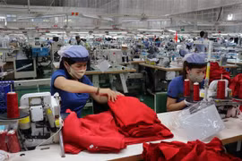 Công nhân dệt may tại một doanh nghiệp. (Ảnh minh họa. Nguồn: TTXVN)