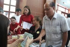 Người dân có đất bị thu hồi được nhận số tiền đền bù, hỗ trợ rất lớn. (Ảnh: Công Phong/TTXVN)