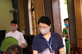 Bị cáo Nguyễn Thanh Nhàn (nguyên Phó trưởng Phòng khảo thí và quản lý chất lượng giáo dục, Sở Giáo dục và Đào tạo tỉnh Sơn La) tại phiên tòa. (Ảnh: Hữu Quyết/TTXVN)